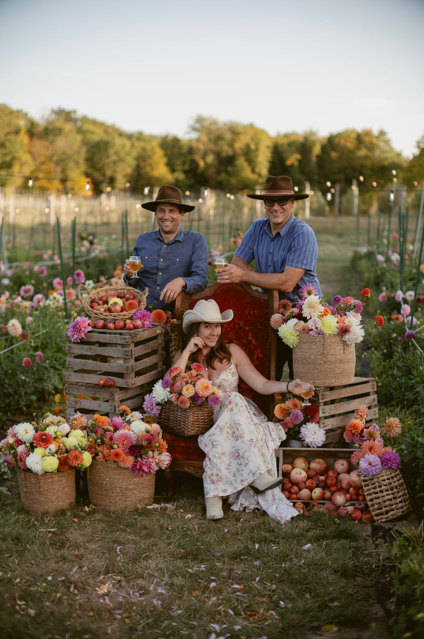 bird dog farm and cidery makers, along with shannon from fox cottage farm in the middle of the dahlia field surrounded by dahlias